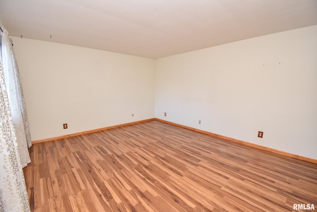 unfurnished room featuring light hardwood / wood-style floors