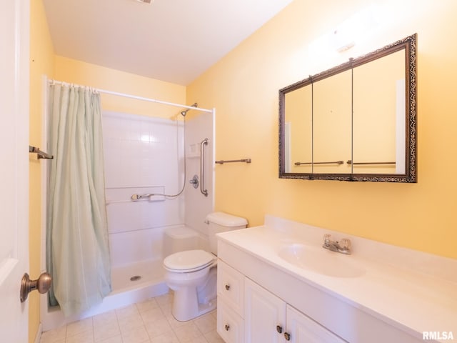 bathroom with toilet, tile patterned flooring, walk in shower, and vanity