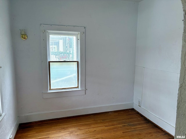 unfurnished room featuring wood-type flooring