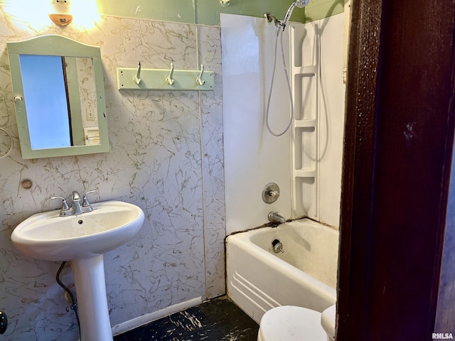 full bathroom with sink,  shower combination, and toilet