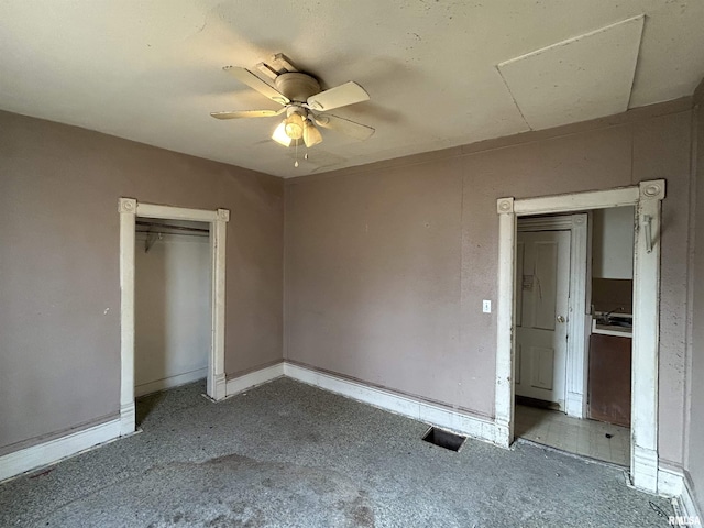 unfurnished bedroom featuring light carpet, a closet, and ceiling fan