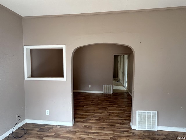 empty room featuring dark wood-type flooring