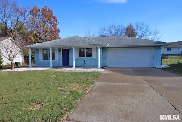 ranch-style house featuring a front yard and a garage