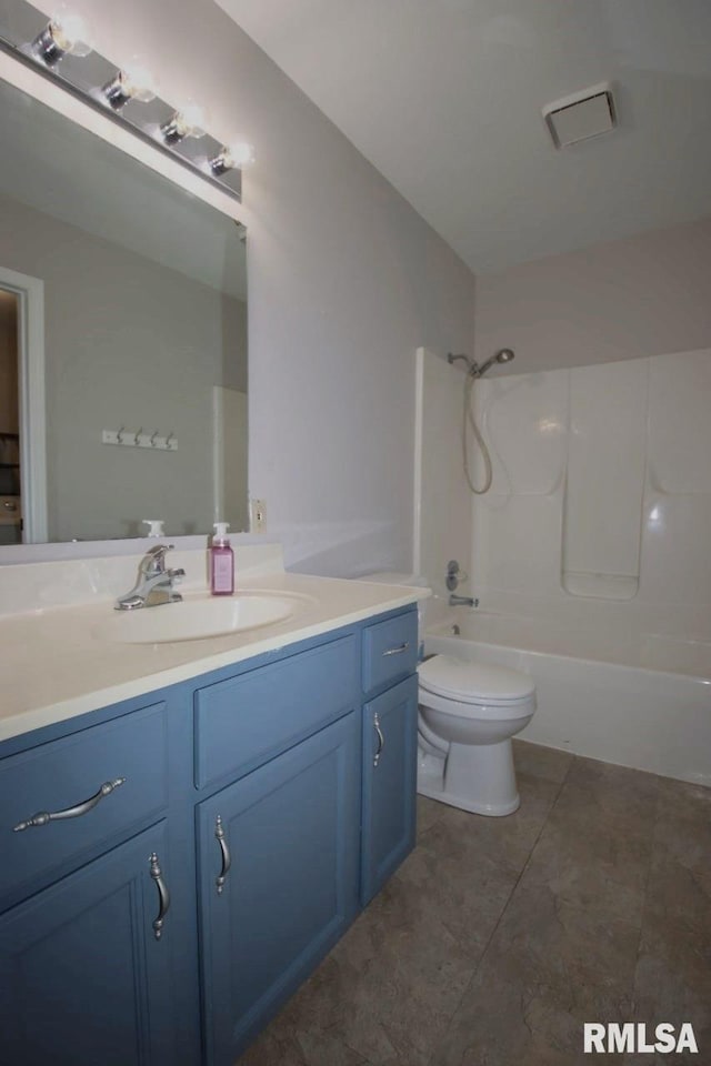 full bathroom featuring tile patterned floors, vanity, shower / bath combination, and toilet