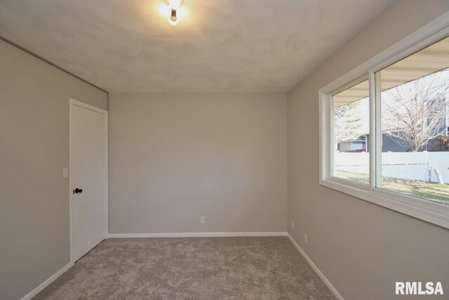 empty room featuring light colored carpet