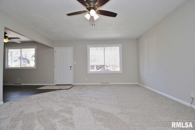 carpeted empty room with ceiling fan