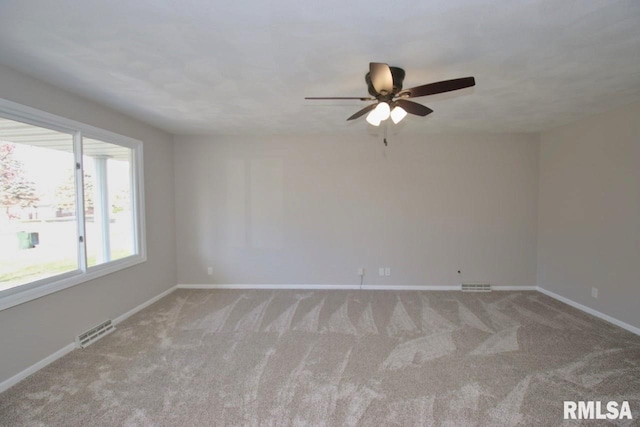 carpeted empty room with ceiling fan