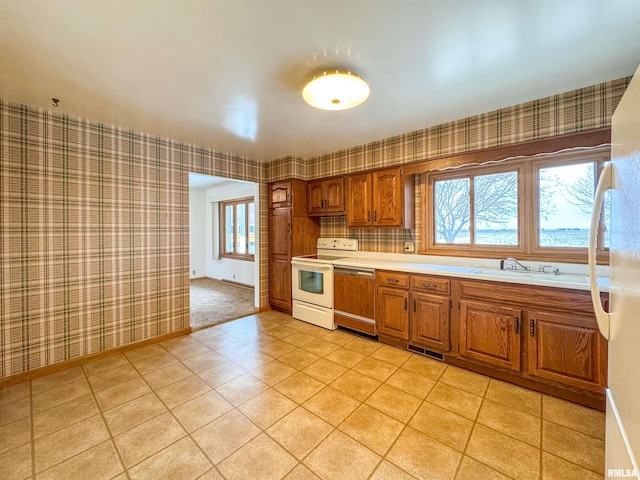 kitchen featuring sink and white appliances