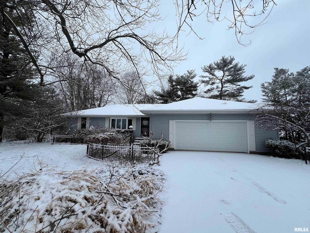 ranch-style house featuring a garage