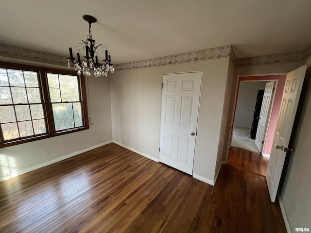 interior space with dark hardwood / wood-style flooring and a chandelier