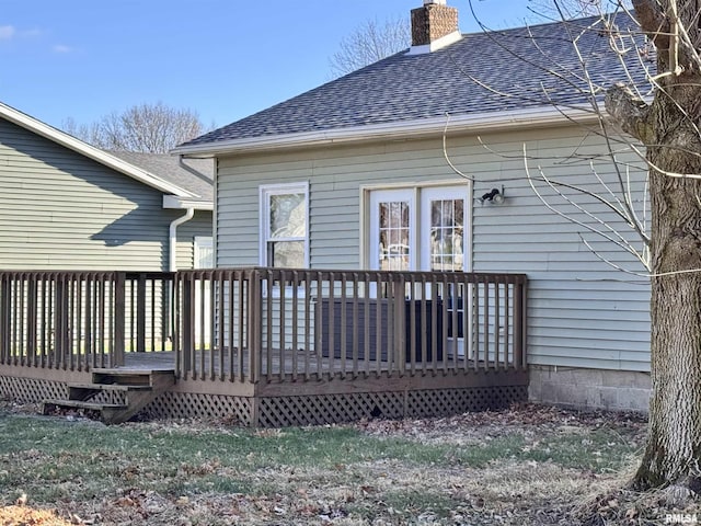 back of property featuring a deck