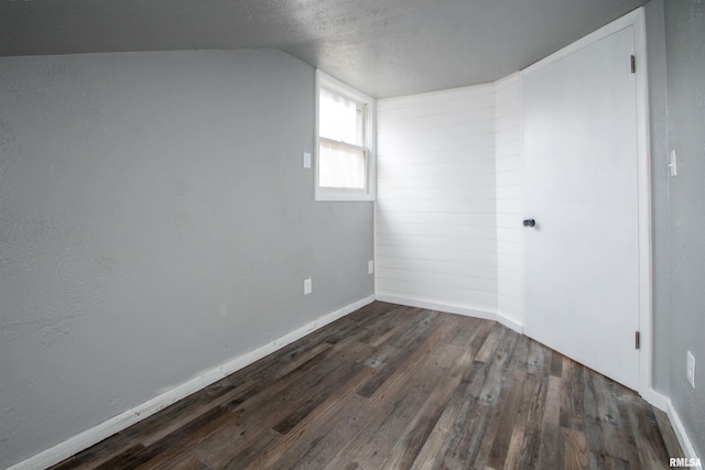 spare room with dark hardwood / wood-style floors