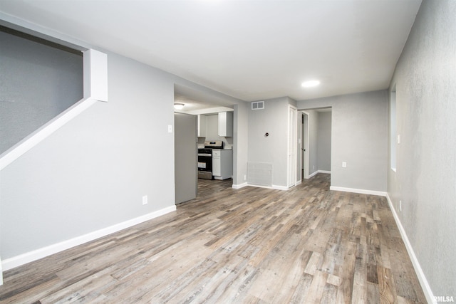 unfurnished living room with light wood-type flooring