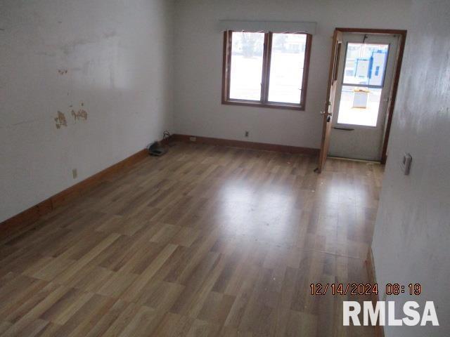 unfurnished room featuring hardwood / wood-style flooring