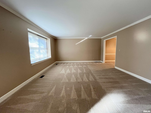 empty room with carpet flooring and ornamental molding