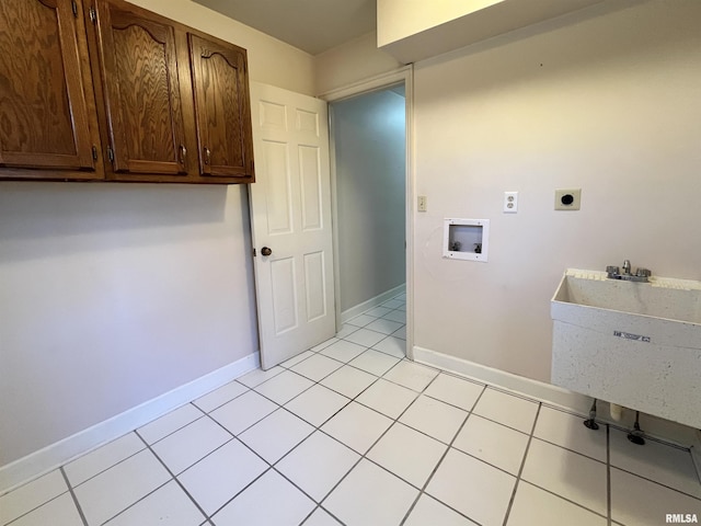 clothes washing area with cabinets, hookup for a washing machine, light tile patterned floors, and electric dryer hookup