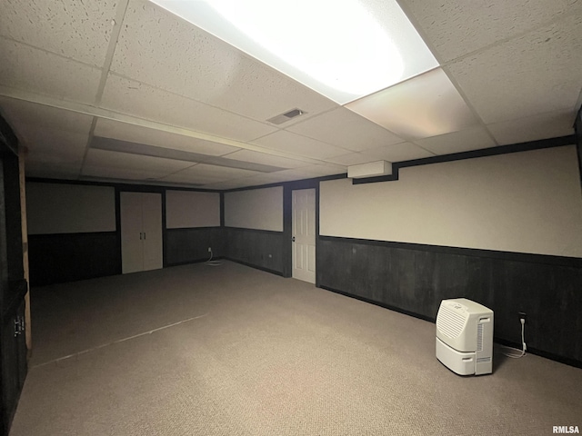 basement featuring a paneled ceiling