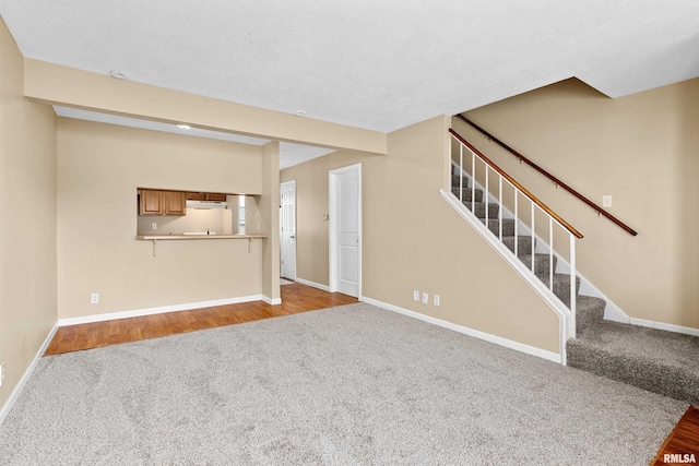 unfurnished living room with carpet flooring