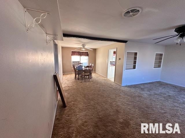 interior space featuring ceiling fan and carpet floors