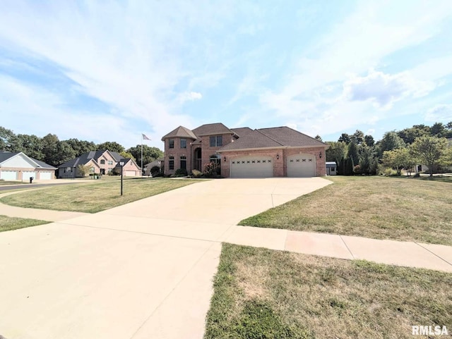 view of front of property featuring a garage and a front lawn