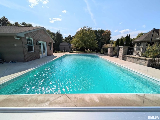 view of pool featuring french doors and a patio