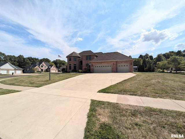 view of front of property featuring a garage and a front yard