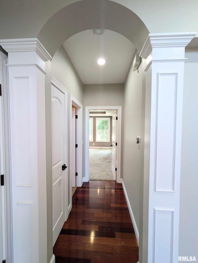 corridor with dark hardwood / wood-style floors