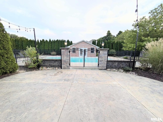 view of gate featuring a fenced in pool