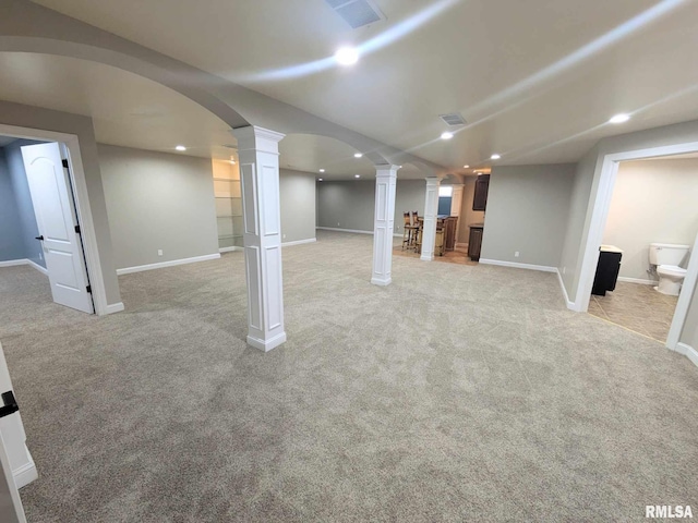 basement featuring light colored carpet