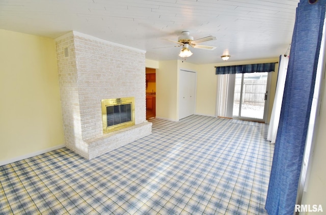 unfurnished living room featuring a fireplace and ceiling fan