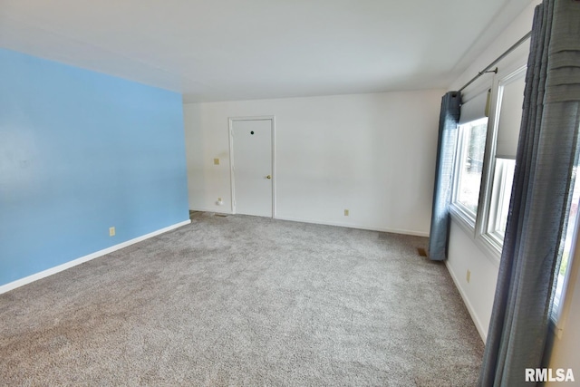 unfurnished room with carpet floors