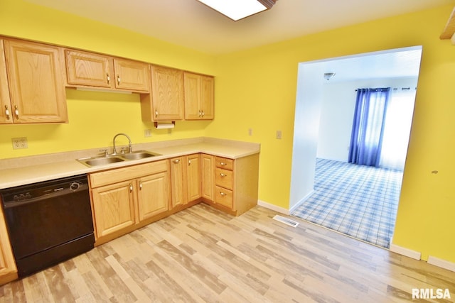 kitchen featuring light brown cabinetry, dishwasher, light hardwood / wood-style floors, and sink