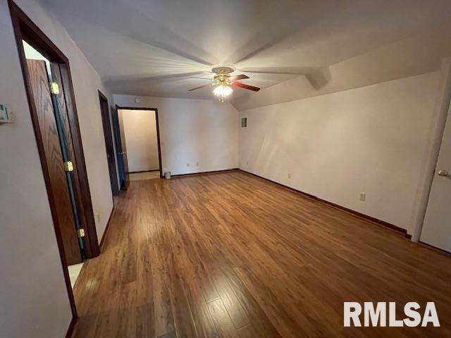 unfurnished room featuring hardwood / wood-style floors and ceiling fan