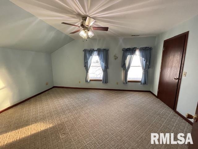 additional living space featuring carpet, ceiling fan, and lofted ceiling