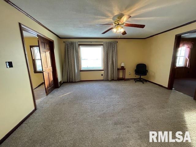 interior space featuring light colored carpet, ceiling fan, and crown molding