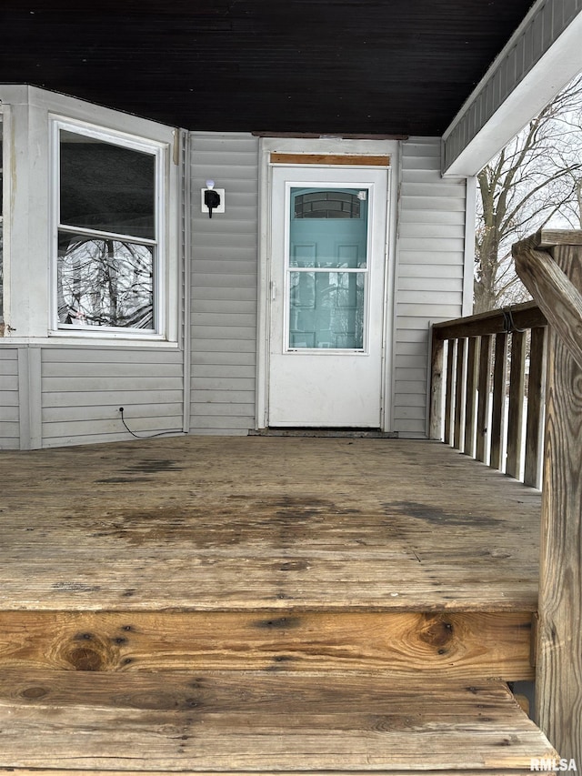 doorway to property with a wooden deck