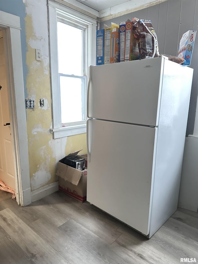 kitchen featuring white fridge and light wood-type flooring