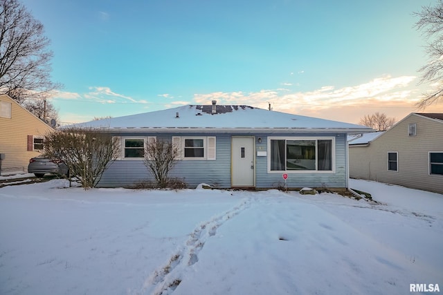 view of snow covered property