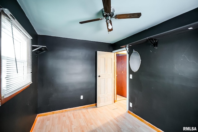 unfurnished bedroom featuring light hardwood / wood-style floors and ceiling fan