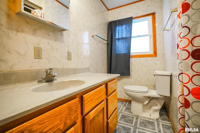 bathroom with vanity, toilet, and curtained shower