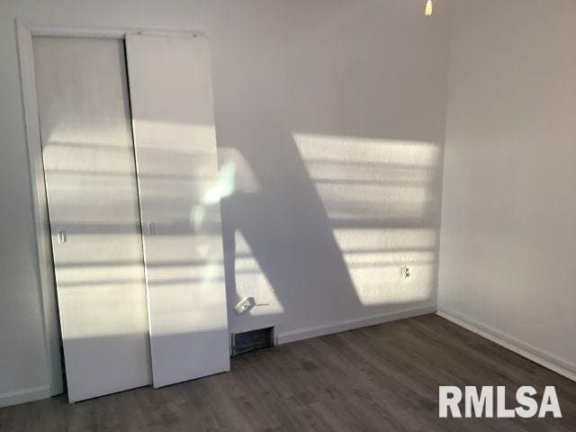 unfurnished bedroom featuring wood-type flooring