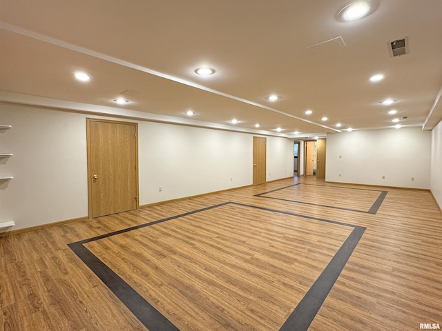 spare room featuring light wood-type flooring