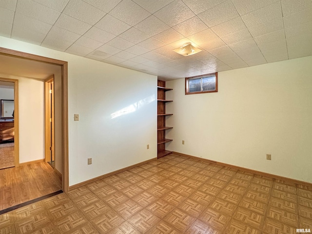 basement with light parquet floors