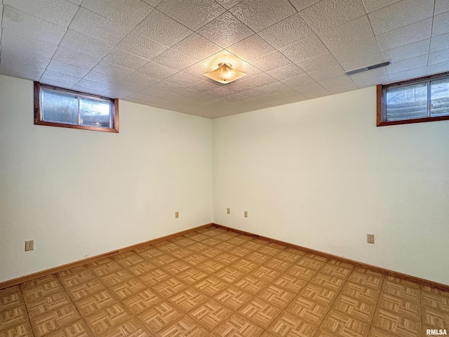 basement featuring light parquet floors