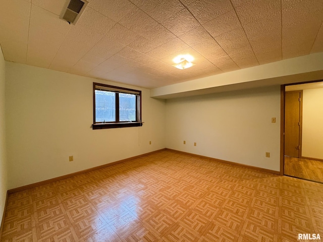 basement with light parquet floors