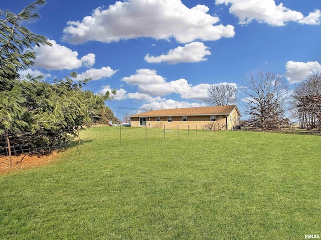 view of yard with a rural view