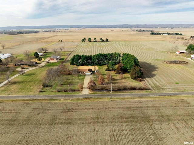 birds eye view of property with a rural view