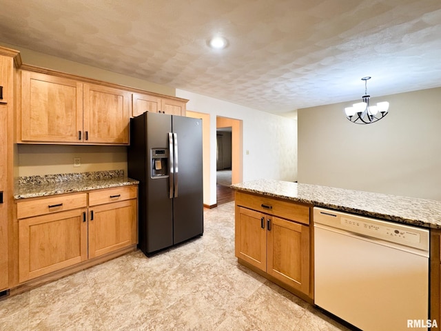 kitchen featuring light stone countertops, pendant lighting, a textured ceiling, stainless steel fridge with ice dispenser, and white dishwasher