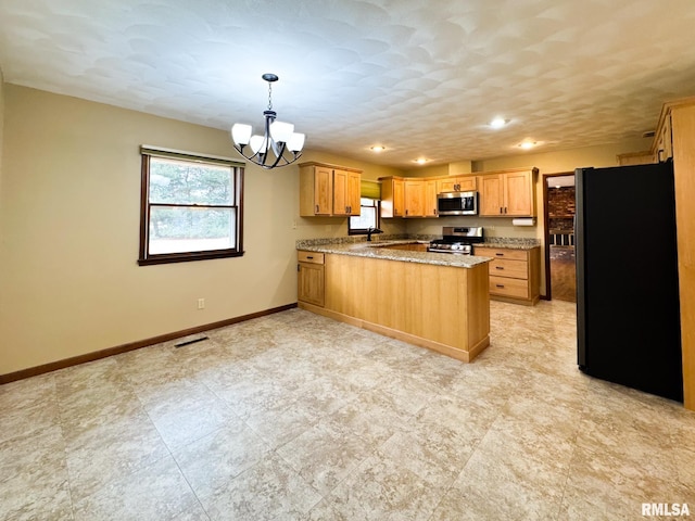 kitchen featuring kitchen peninsula, hanging light fixtures, sink, a notable chandelier, and stainless steel appliances