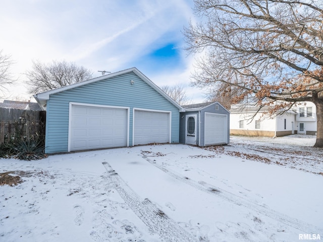 view of front of property featuring an outbuilding and a garage